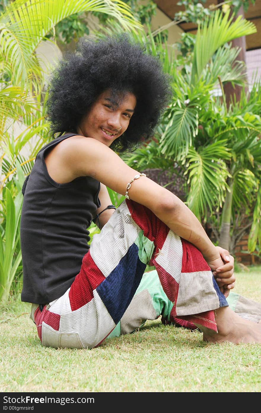 Thai man with a big afro hairstyle.