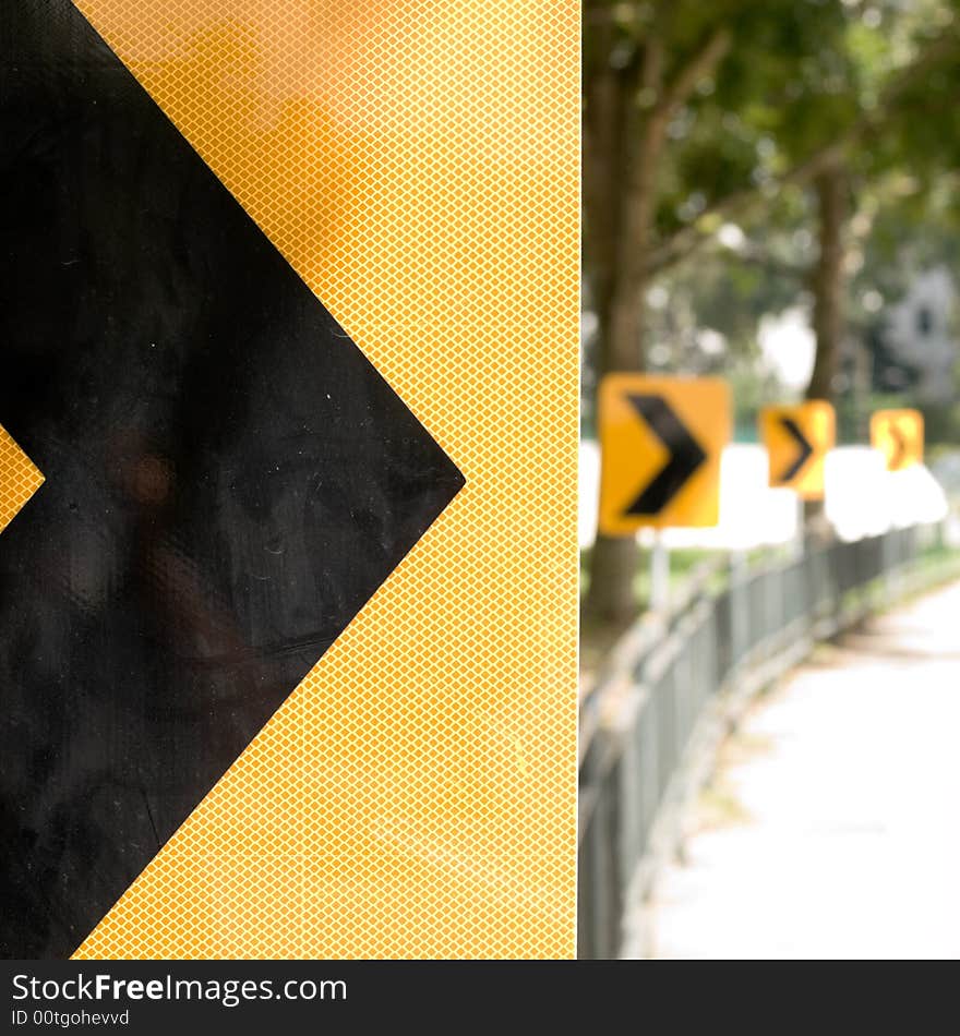 Road signage at a bend in a road. Road signage at a bend in a road