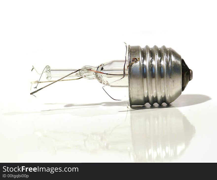 The burned-out light bulb on a white background. The burned-out light bulb on a white background.