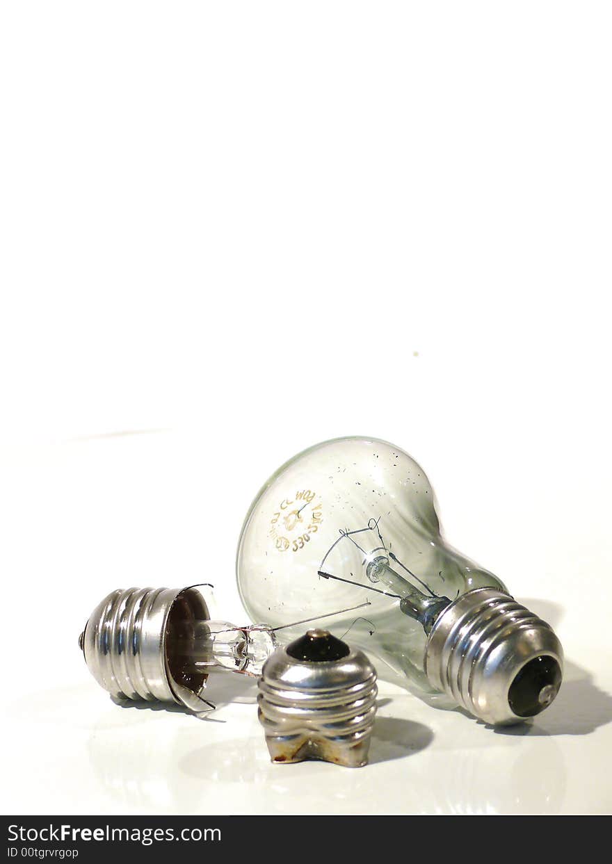 The burned-out light bulb on a white background. The burned-out light bulb on a white background.