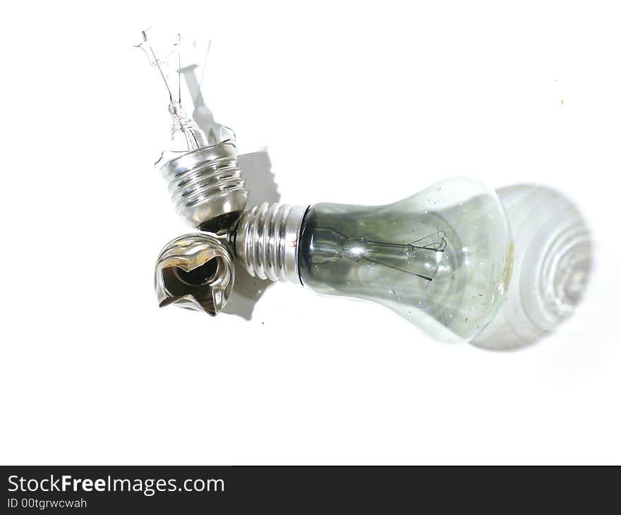 The burned-out light bulb on a white background. The burned-out light bulb on a white background.