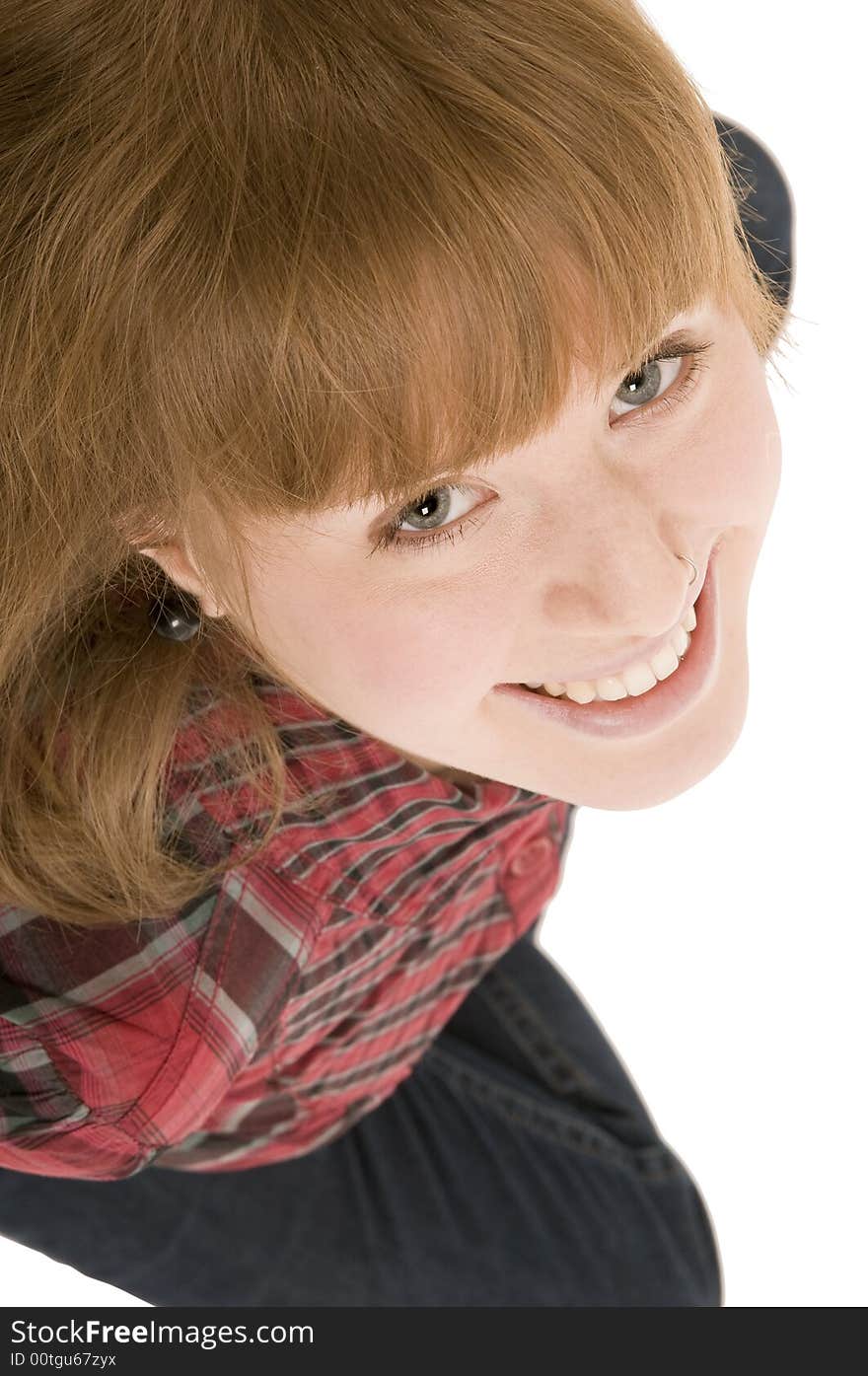 A smiling young woman from above photographs. A smiling young woman from above photographs.