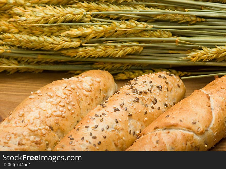 Three bread roll in flat basket and crop