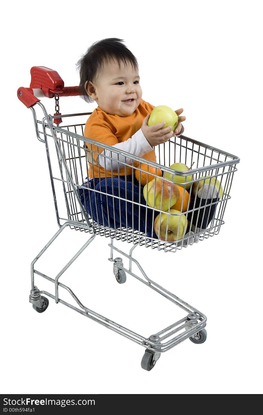 Baby sitting in a shopping cart with fruit before white 
background. Baby sitting in a shopping cart with fruit before white 
background