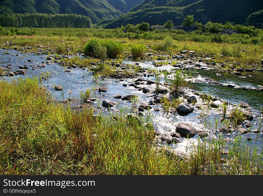 A limpid river running through the mountains. A limpid river running through the mountains