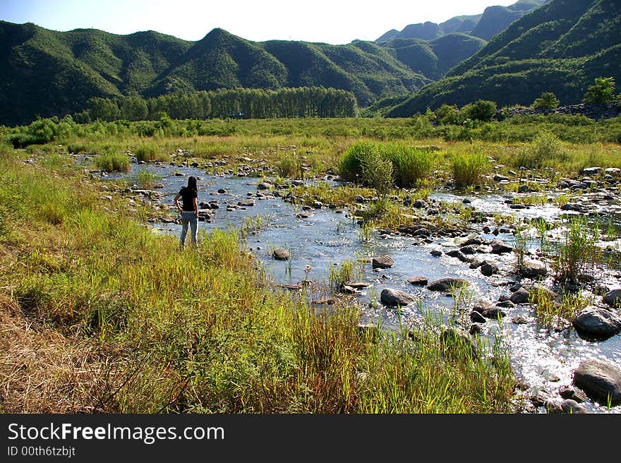 A limpid river running through the mountains. A limpid river running through the mountains