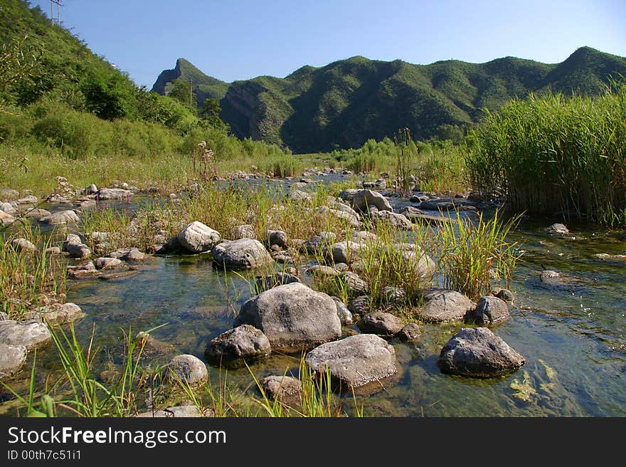 A limpid river running through the mountains. A limpid river running through the mountains