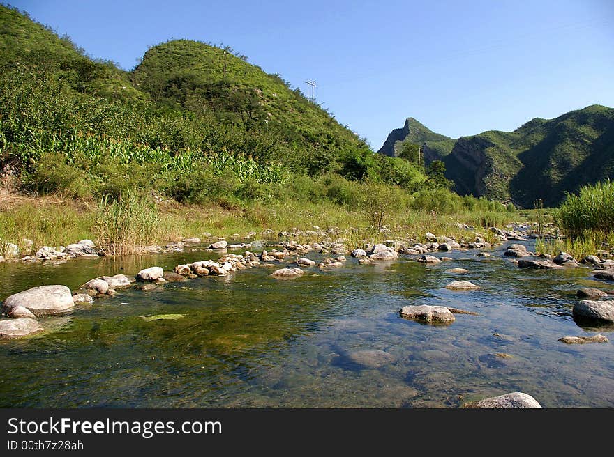 A limpid river running through the mountains. A limpid river running through the mountains