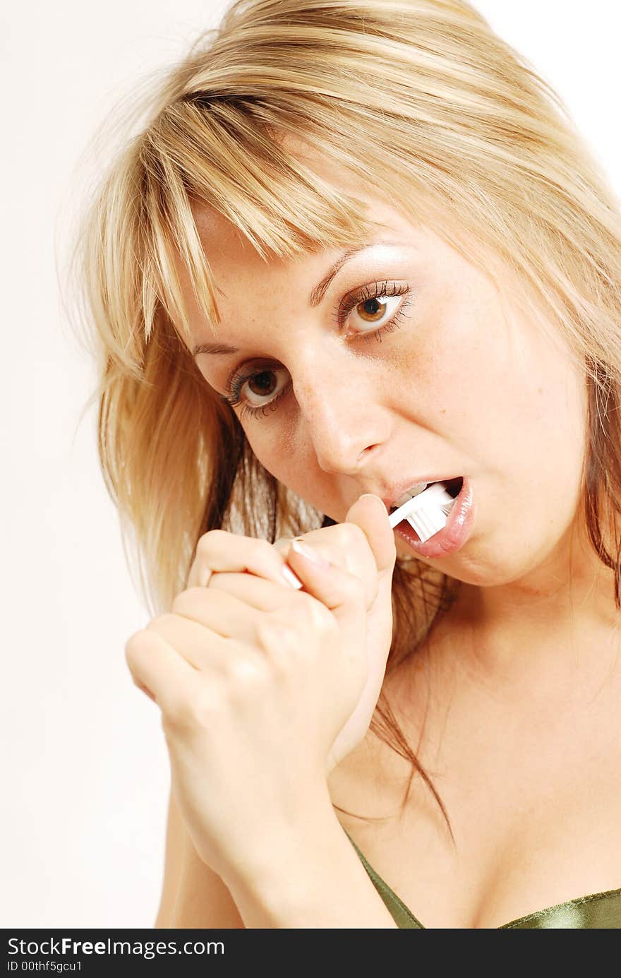 A young woman with a toothbrush. A young woman with a toothbrush