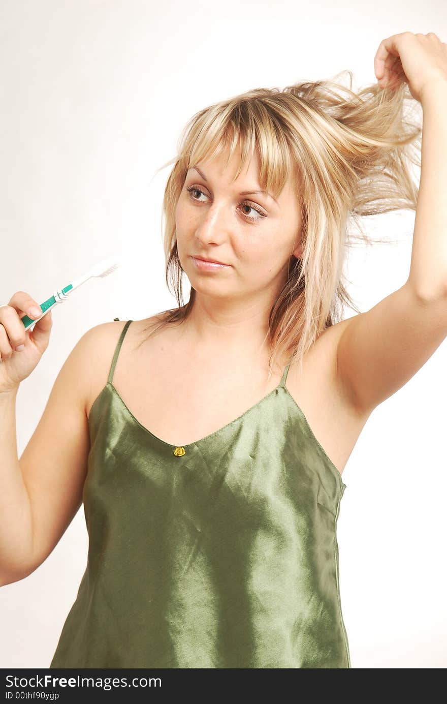 A young woman with a toothbrush. A young woman with a toothbrush