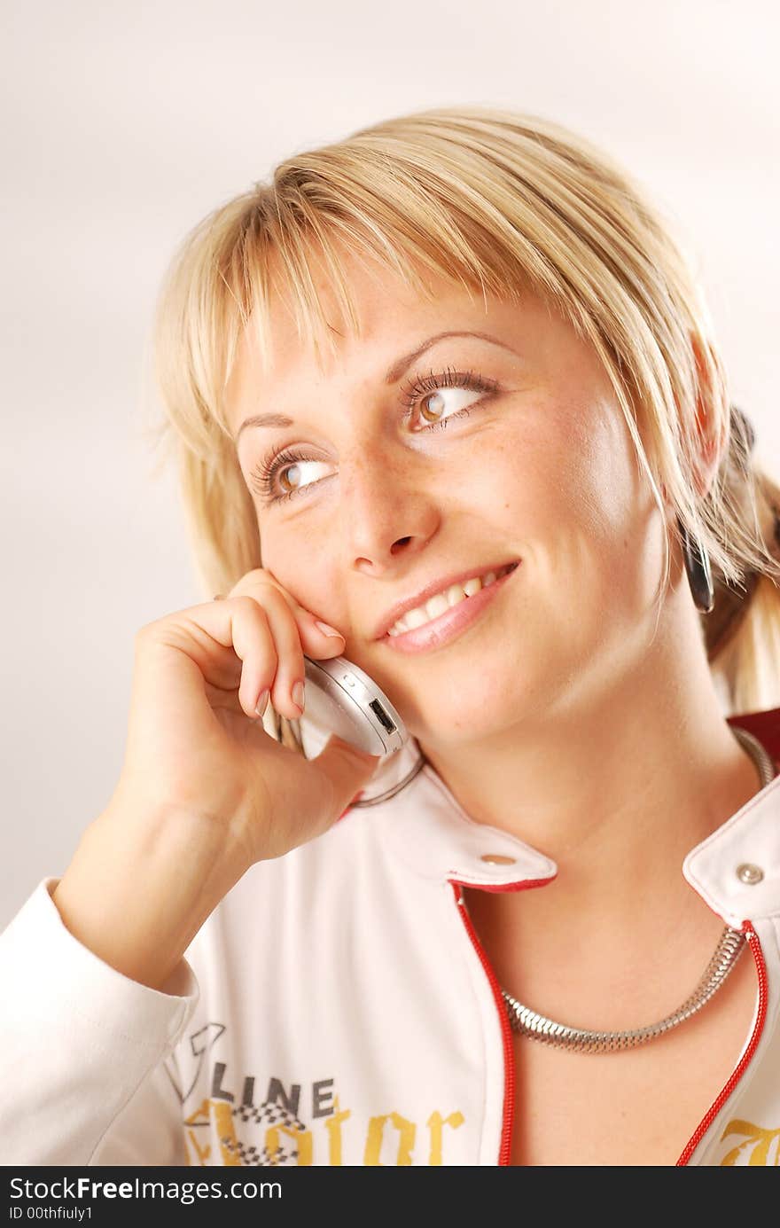 A woman calling from her cellphone. A woman calling from her cellphone