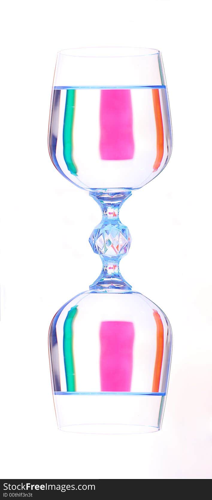 Coloured varicoloured wineglasses with reflections