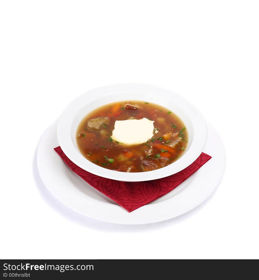 A plate of solyanka soup on white background