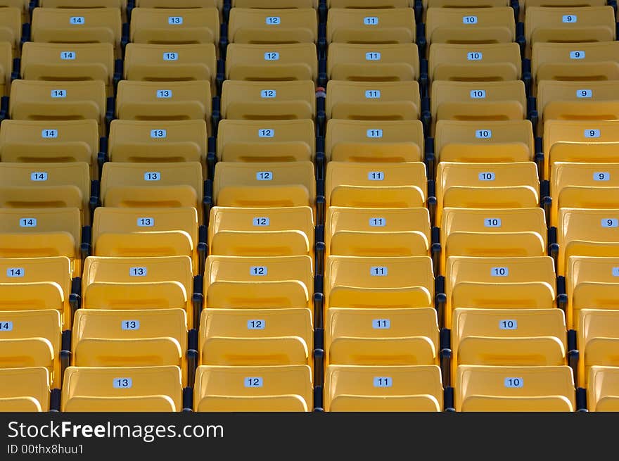 Empty Yellow Numbered Stadium Seating