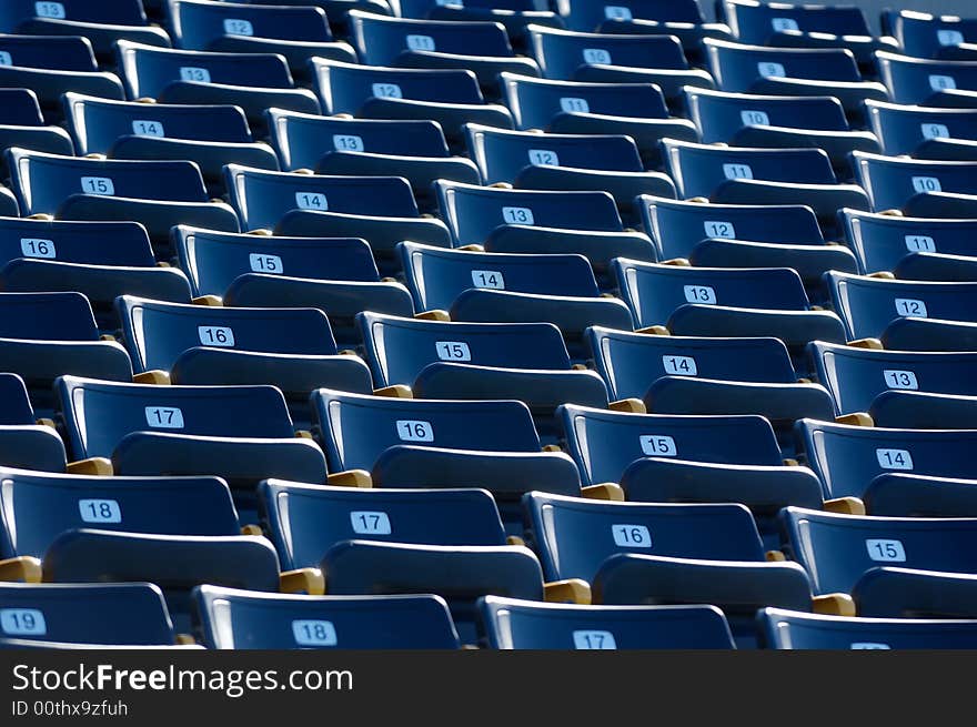 Empty Blue Numbered Stadium Seating