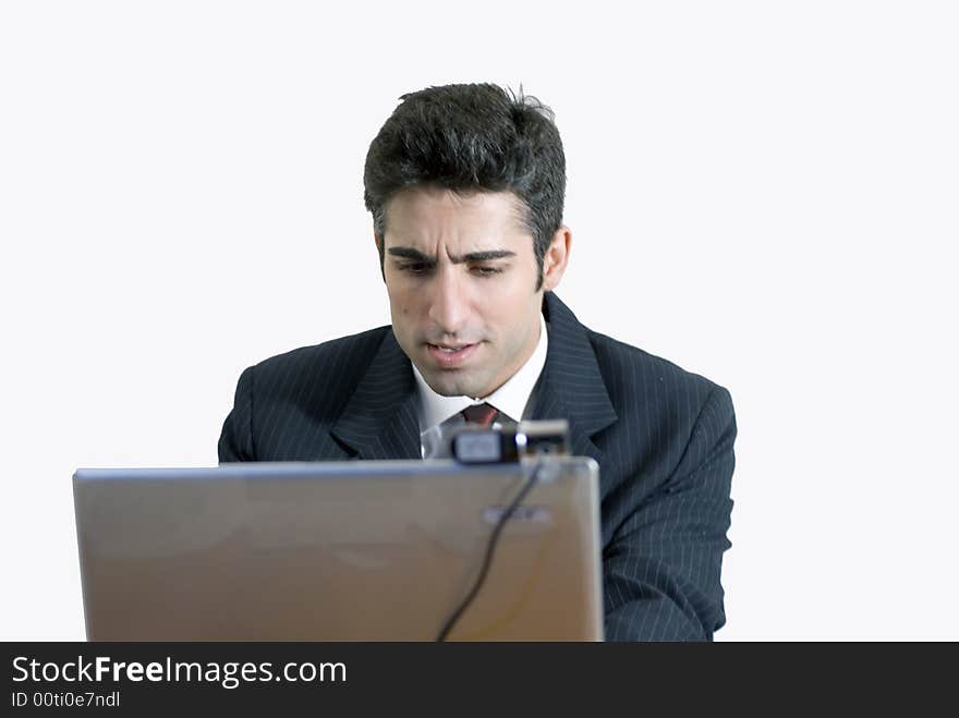 Business man with his forehead crinkled in concentration. Isolated againsts a white background. Business man with his forehead crinkled in concentration. Isolated againsts a white background