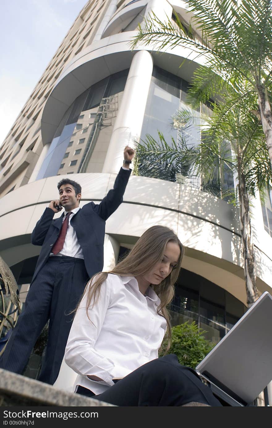 Man and woman working together outside. Man and woman working together outside