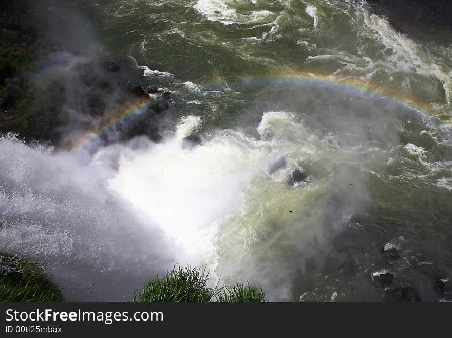 The Iguassu (or Iguazu) Falls is one of the largest masses of fresh water on the planet and divides, in South America, Brazil, Paraguay and Argentina. The waterfall system consists of 275 falls along 2.7 kilometres (1.67 miles) of the Iguazu River. Some of the individual falls are up to 82 metres (269 feet) in height, though the majority are about 64 metres (210 feet). The Iguassu (or Iguazu) Falls is one of the largest masses of fresh water on the planet and divides, in South America, Brazil, Paraguay and Argentina. The waterfall system consists of 275 falls along 2.7 kilometres (1.67 miles) of the Iguazu River. Some of the individual falls are up to 82 metres (269 feet) in height, though the majority are about 64 metres (210 feet).