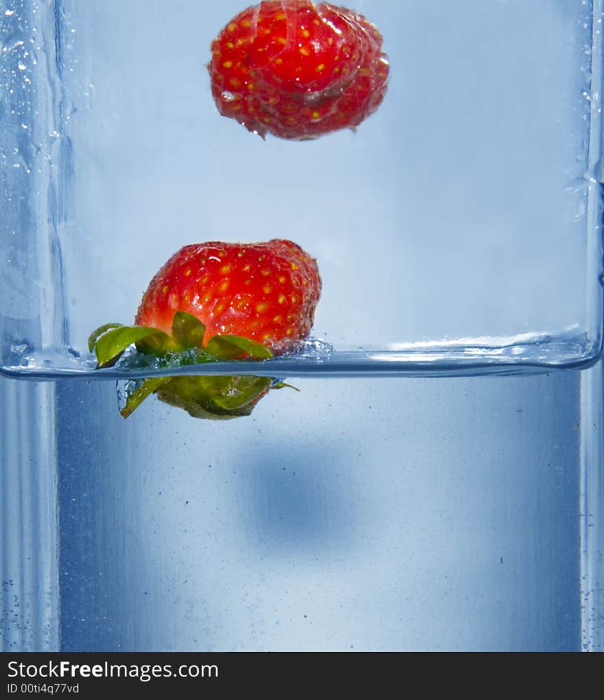 Splashing  two strawberry