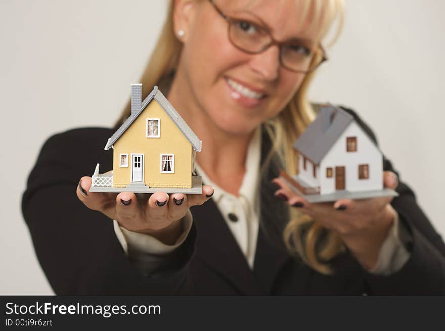 Woman Holding Two Houses