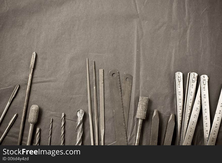 Old tools on black background