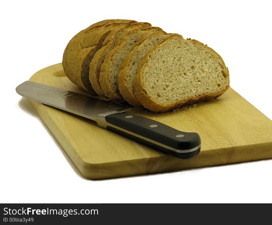 Bread and knife on cutting board