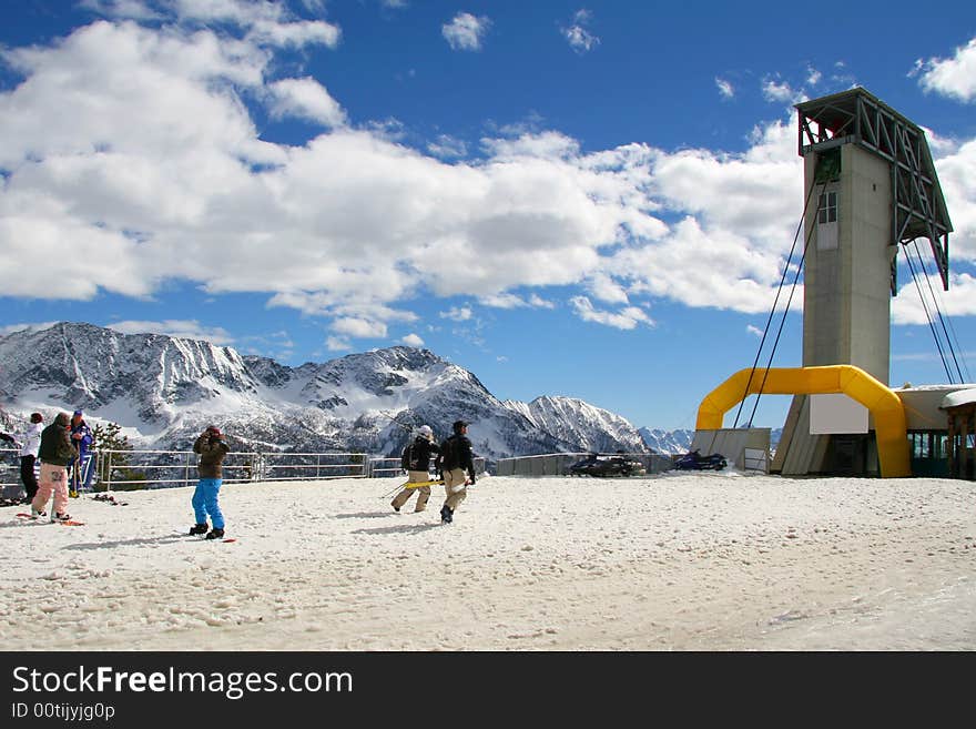 Skiers and snowboarders in ski area. Skiers and snowboarders in ski area