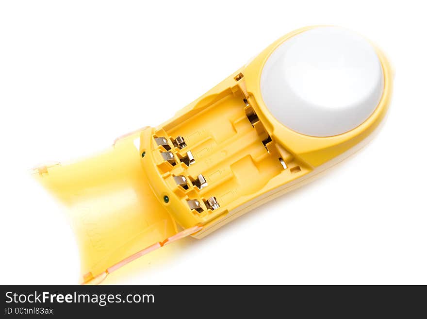 Yellow battery charger over white isolated background