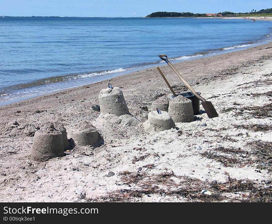 Beach fun - building castles from sea sand. Beach fun - building castles from sea sand