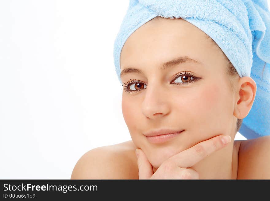 Spa woman in blue towel on white background