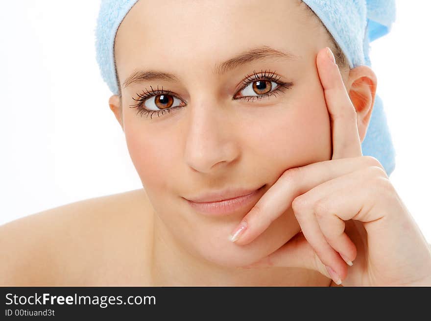 Spa woman in blue towel on white background