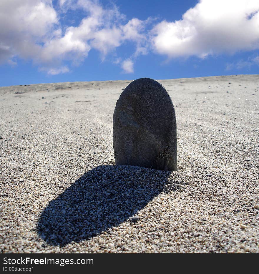 Stone in sand