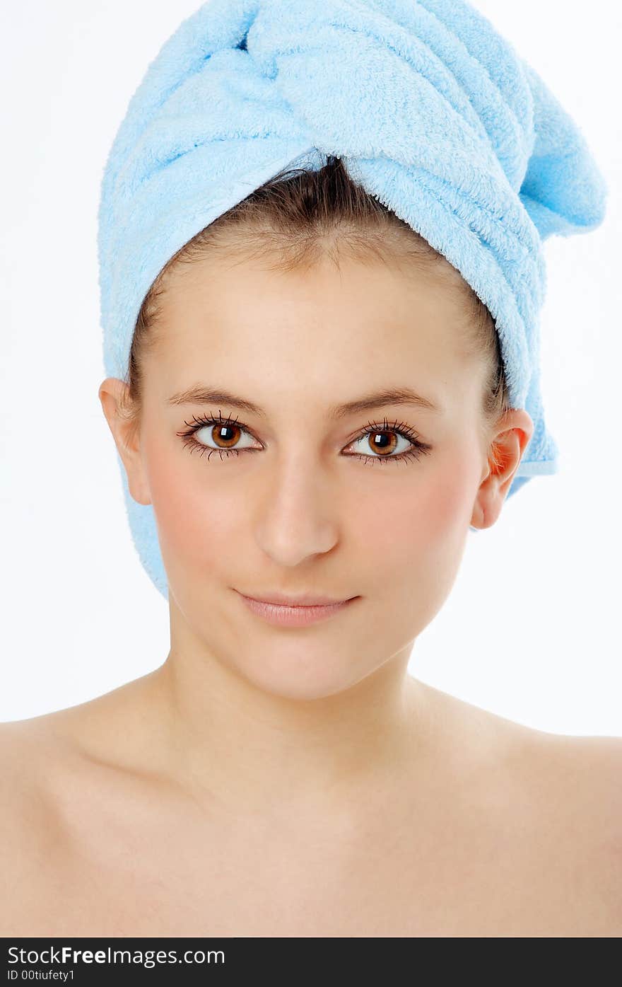 Spa woman in blue towel on white background