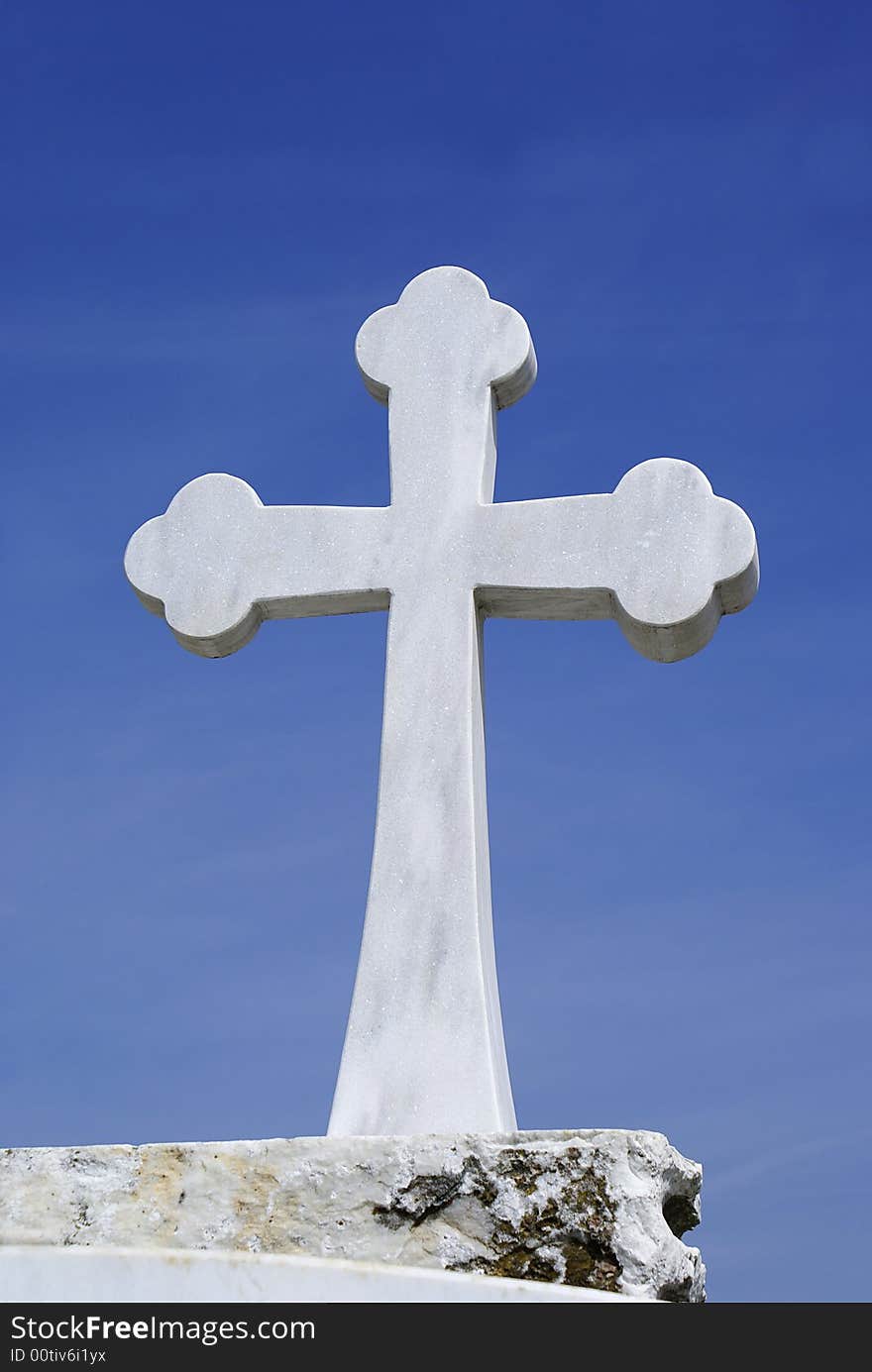 A photo of Cross with white marble