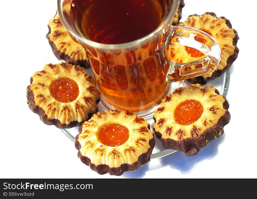 Cookies whith jelly and tea on a white background