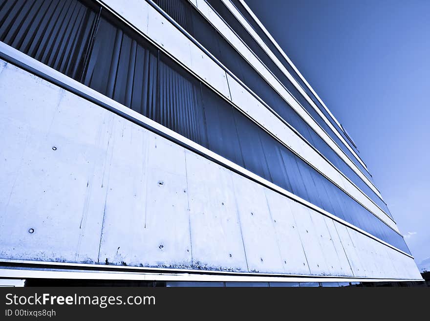 Abstract view of corporate building agaisnt blue sky.