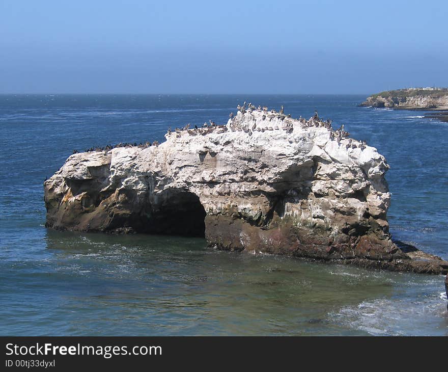 A beach cove and rock formation in Santa Cruz California.