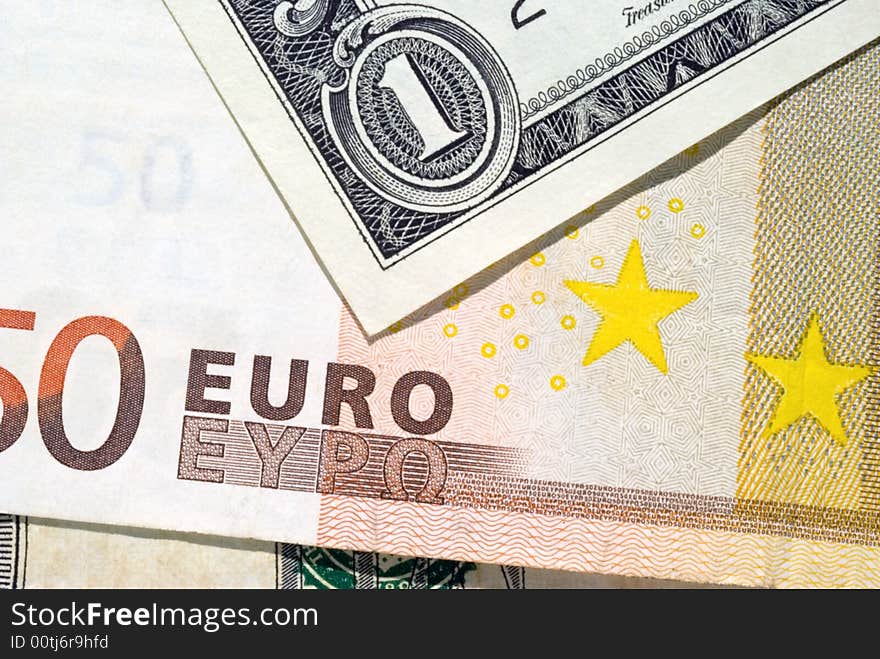 An American dollar bill pointing to the word “Euro” on the currency. An American dollar bill pointing to the word “Euro” on the currency