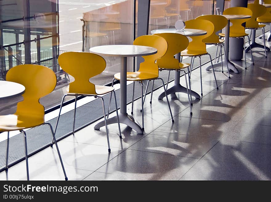 Chairs and tables at small cafe