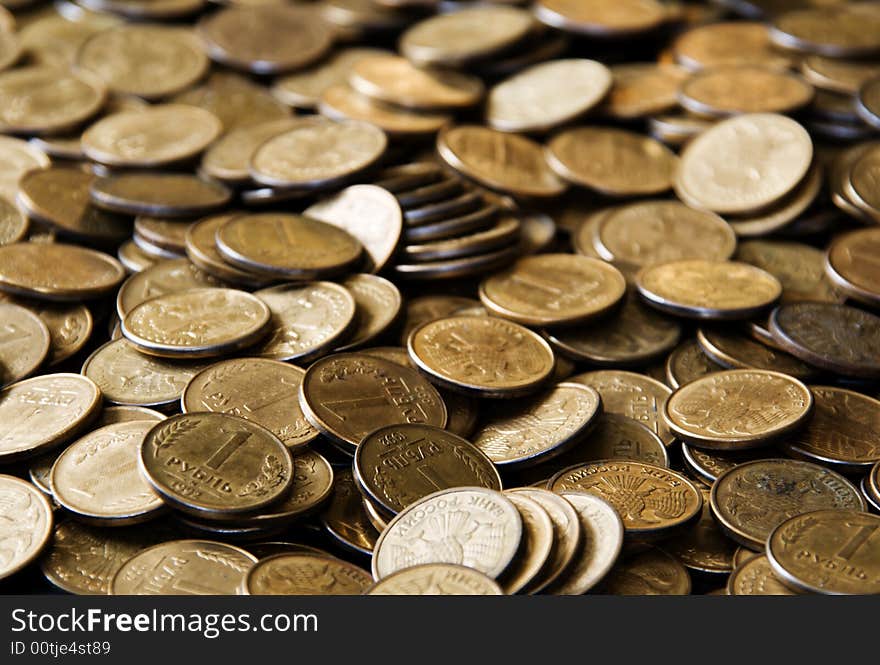 Pile of cooper coins isolated on black