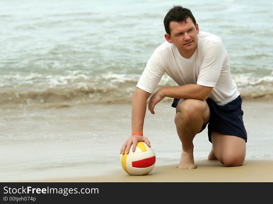 Man holding volleyball on the beach. Man holding volleyball on the beach