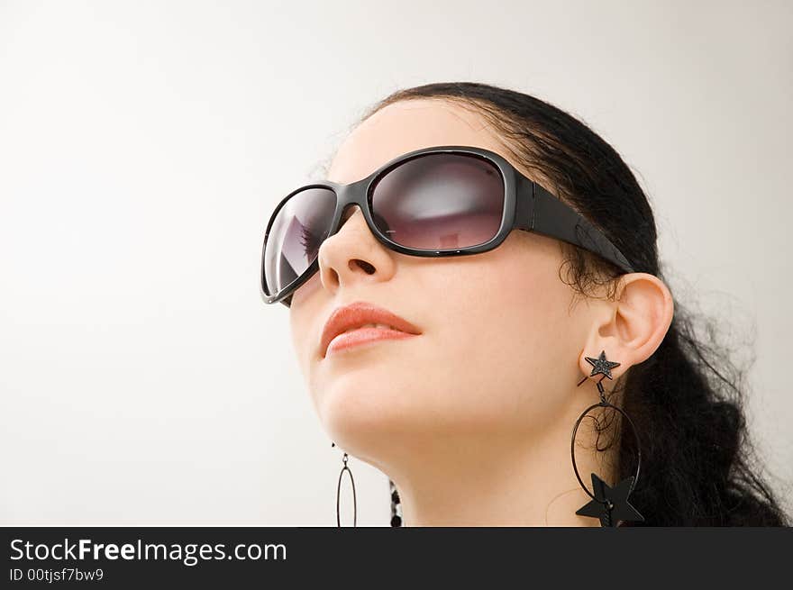 Portrait of hispanic woman with dark sunglasses - isolated on white. Portrait of hispanic woman with dark sunglasses - isolated on white