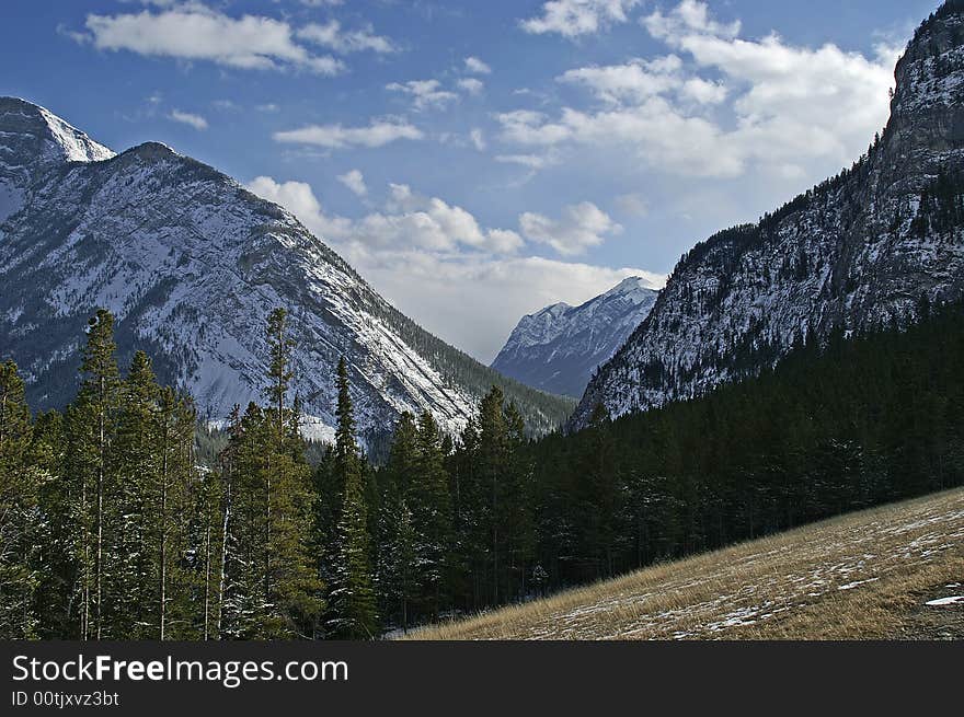 Beautiful view of snow capped mountains from a hilldside. Beautiful view of snow capped mountains from a hilldside