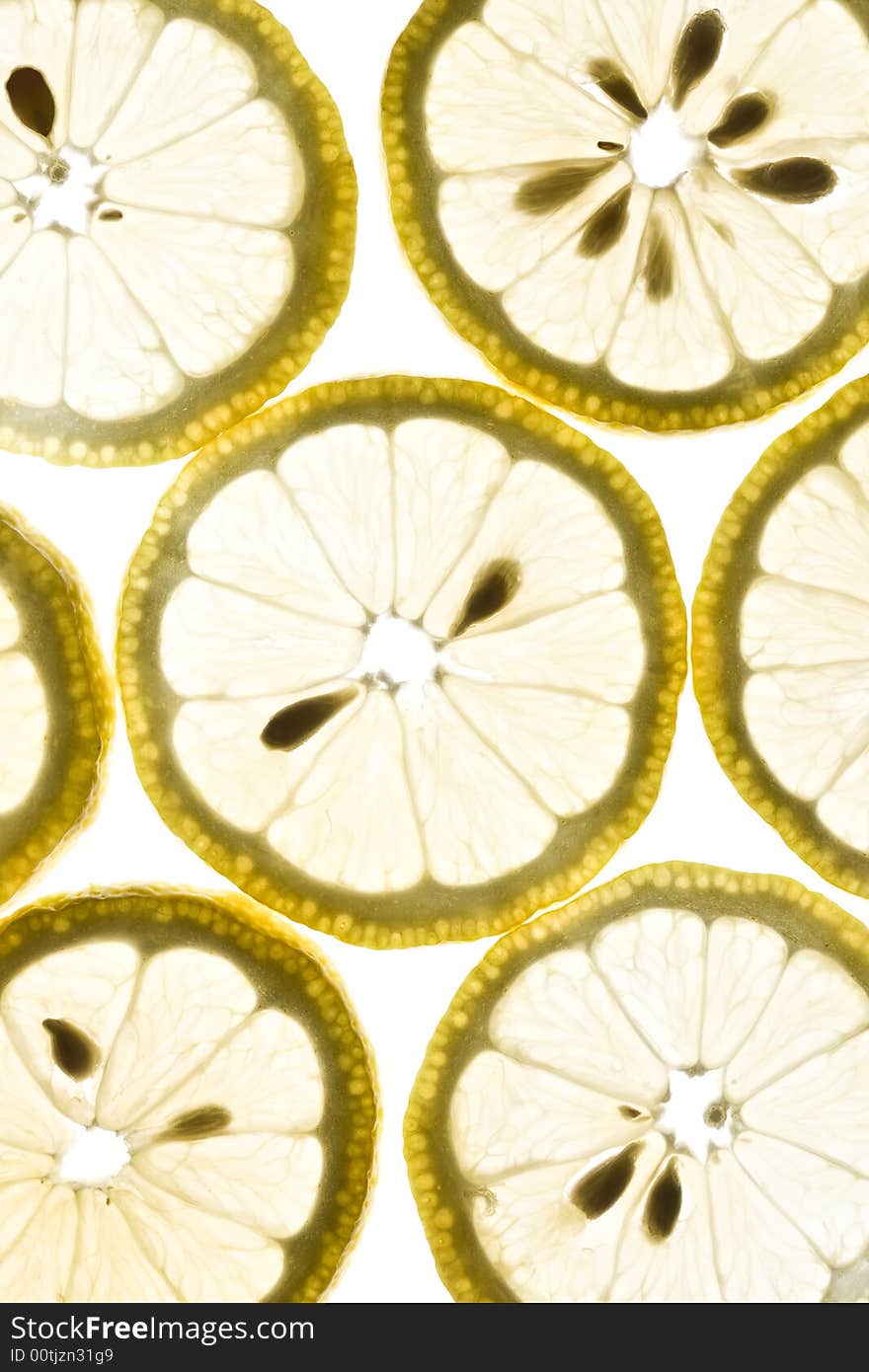 Pattern of lemon slices isolated on white