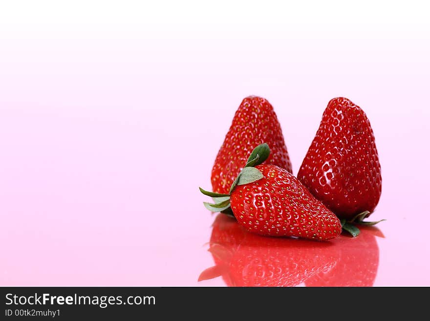 Three fresh and ripe strawberries