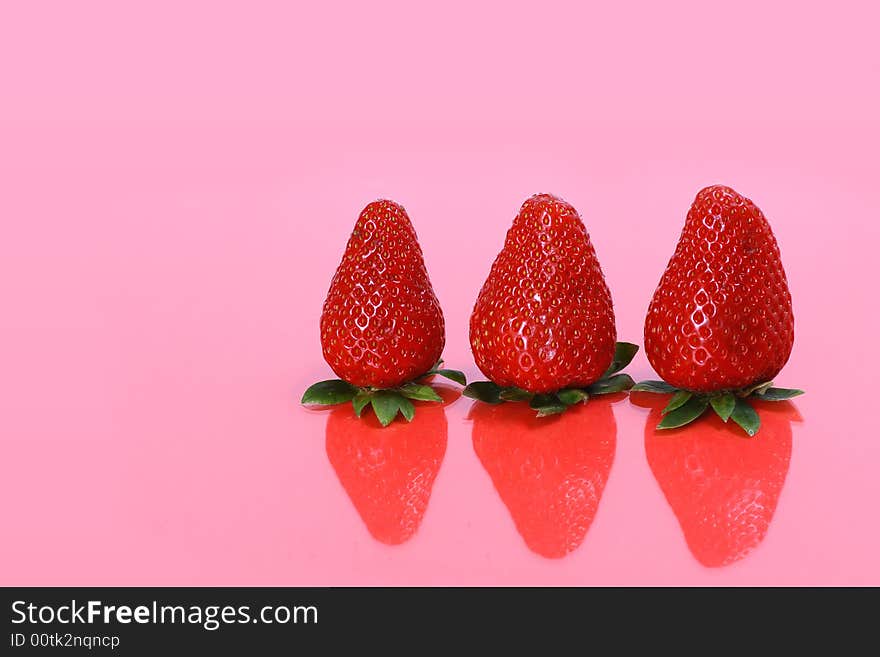 Three fresh and ripe strawberries