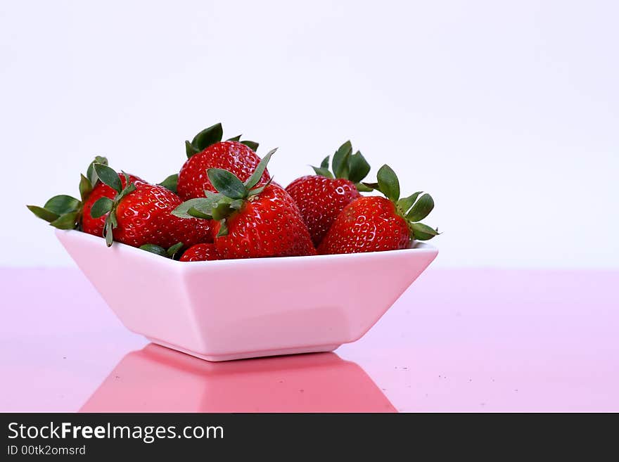 Fresh strawberries in white cup