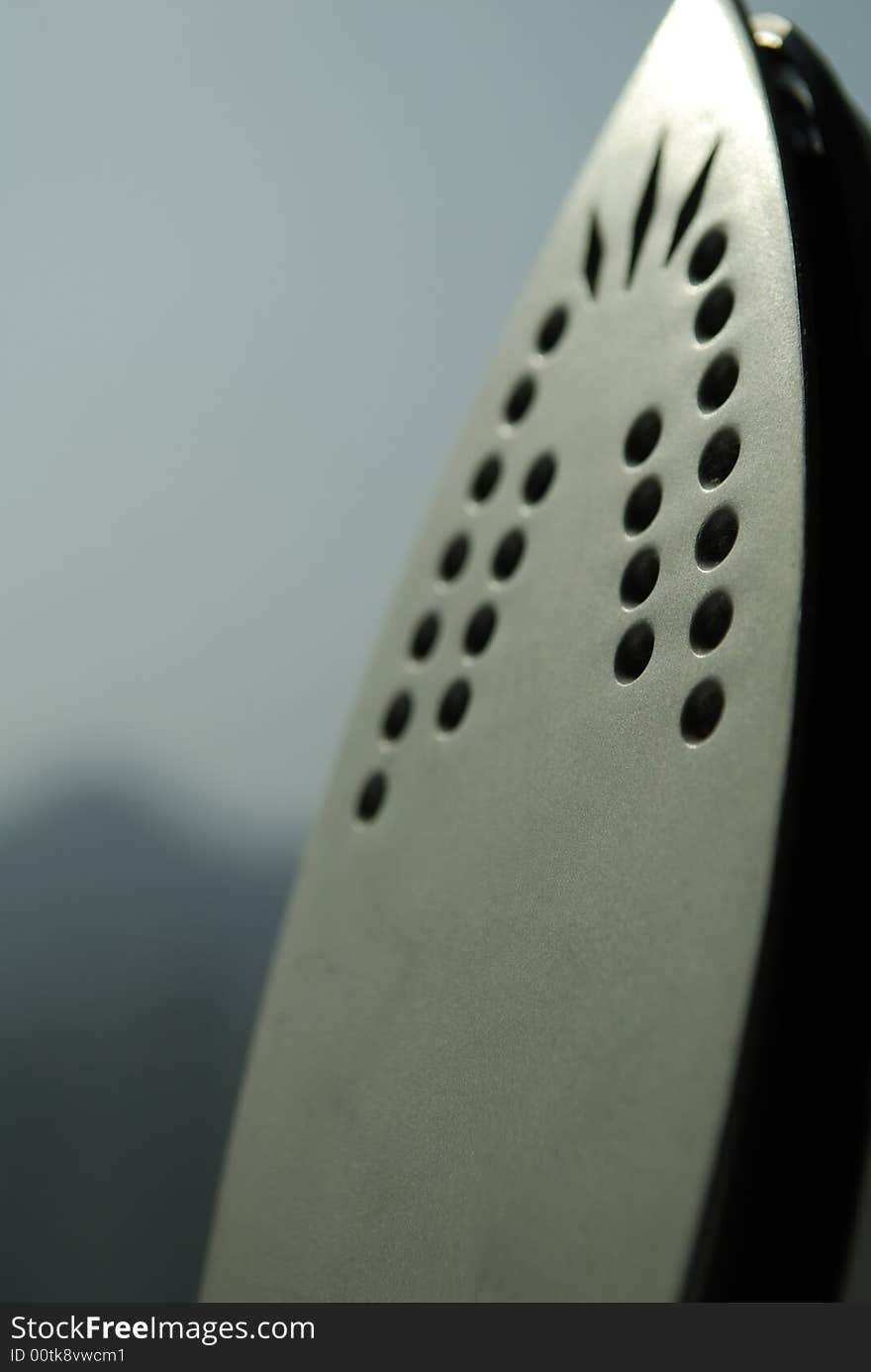 Close up of the metal plate of a steam iron. Close up of the metal plate of a steam iron