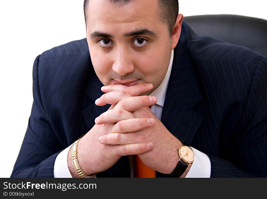 Business man sitting on the chair thinking with hands on his chin