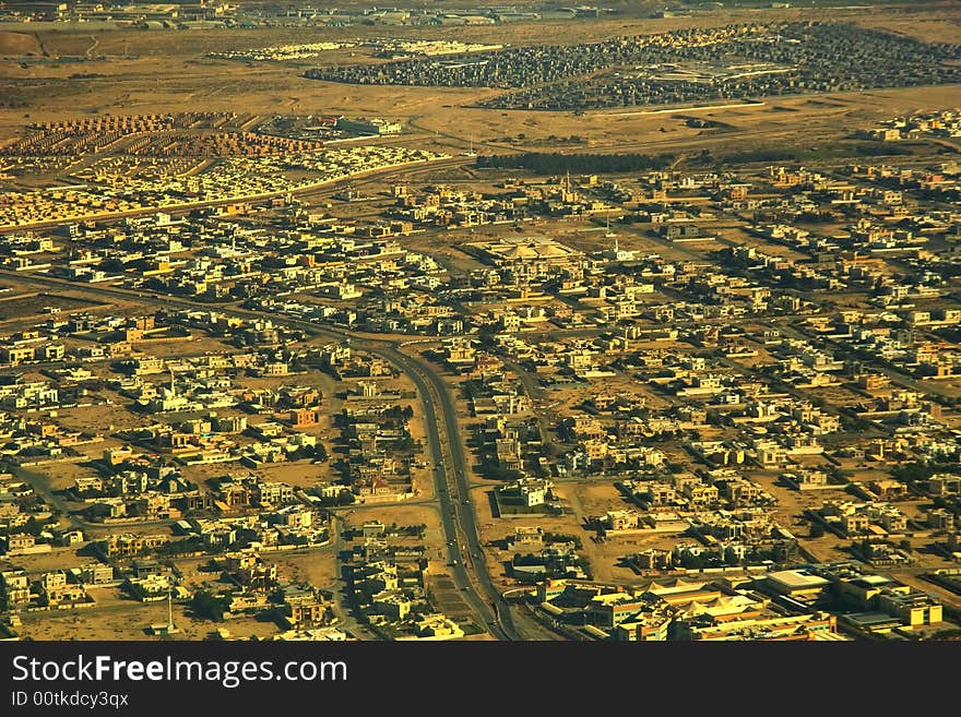 Morning. The typical East old city in desert area  is crossed by roads .  Aerial view .  Morning. The typical East old city in desert area  is crossed by roads .  Aerial view .